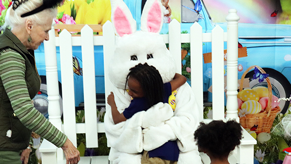 Easter Bunny pauses from pre-holiday preparations to visit cancer center